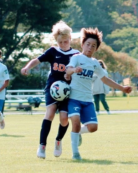 Anthony playing soccer