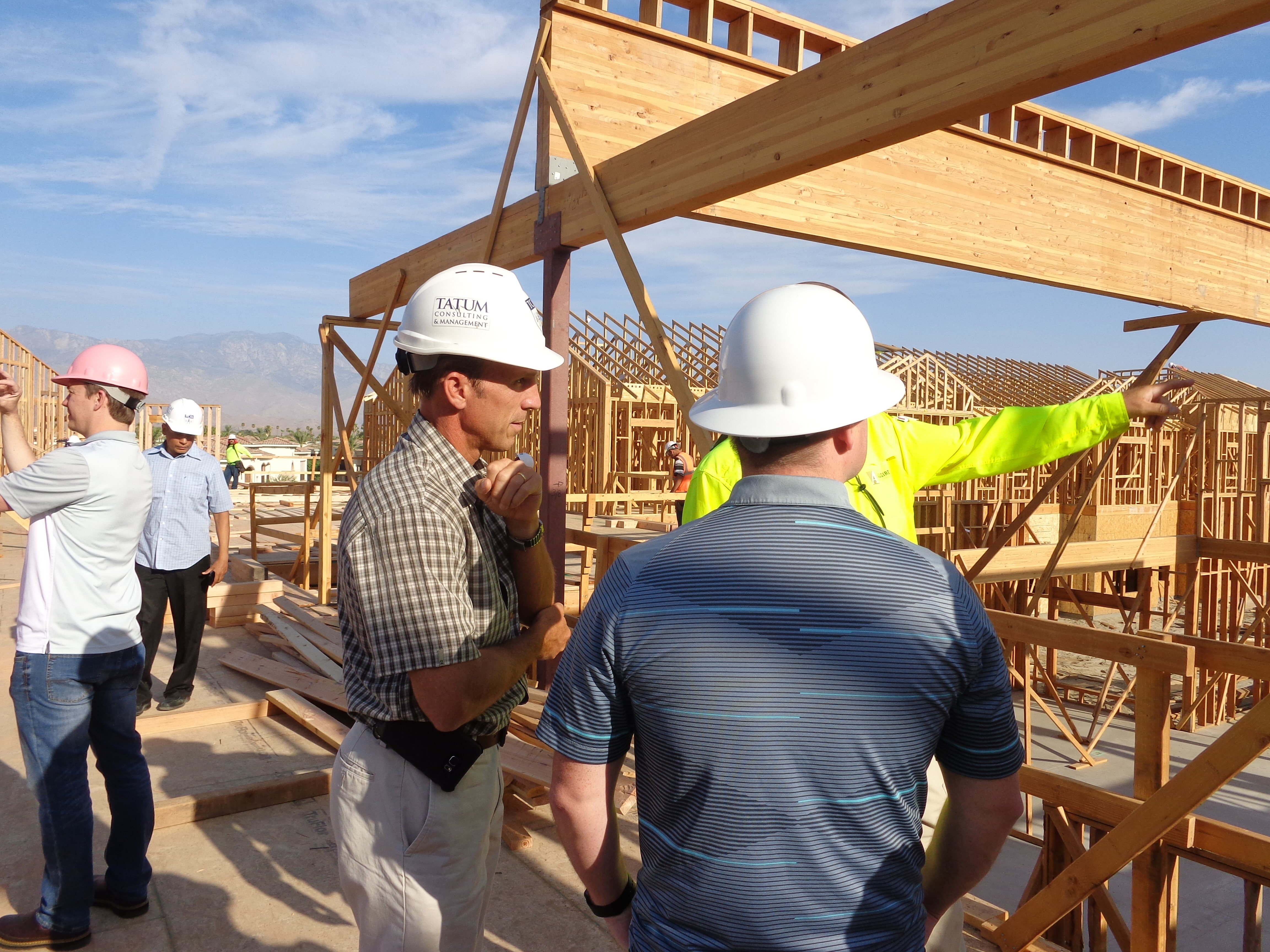 Two construction managers on an active construction site