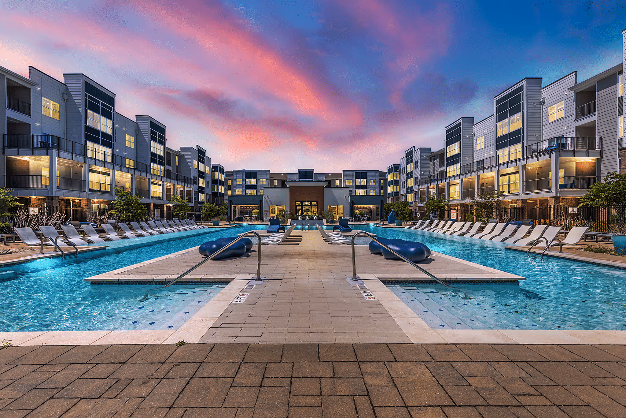 swimming pool with lounge chairs 
