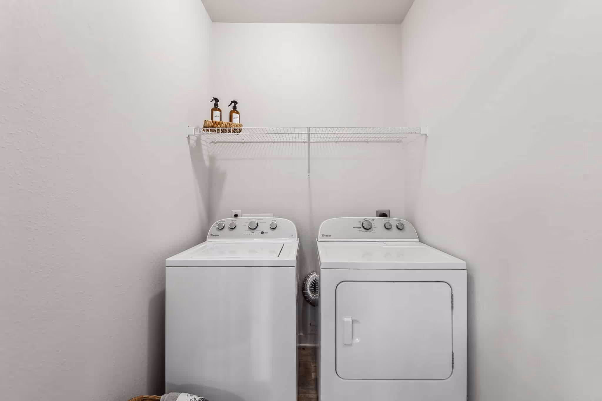 laundry room with washer and dryer machines