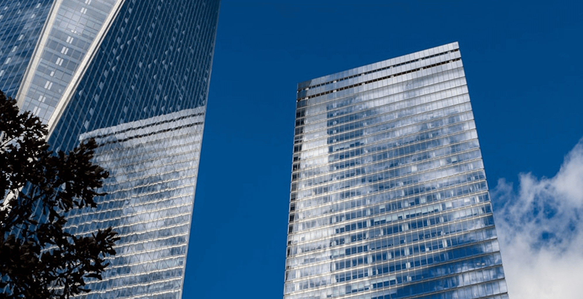 A view of a city at night from across the water.