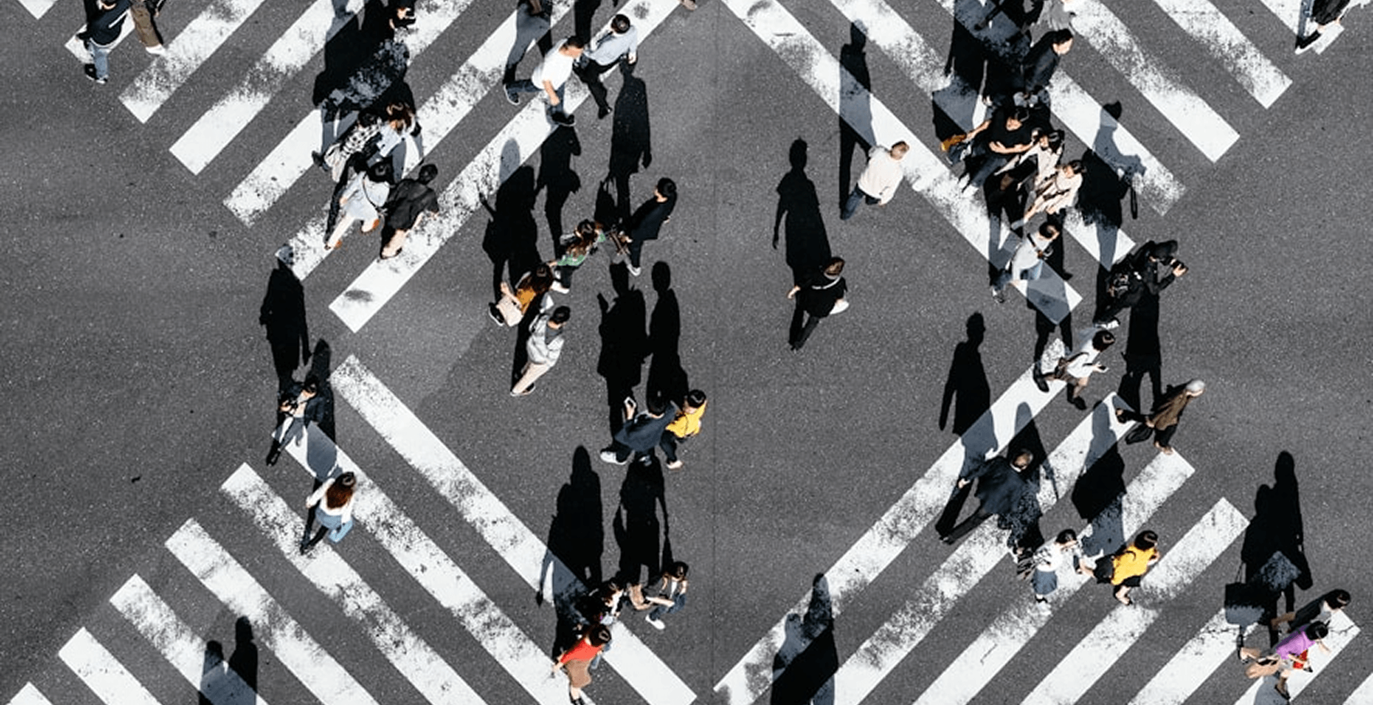 A view of a city at night with a mountain in the background.