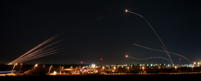 rockets launched from gaza fly towards Israel as Iron Dome interceptors fire back
