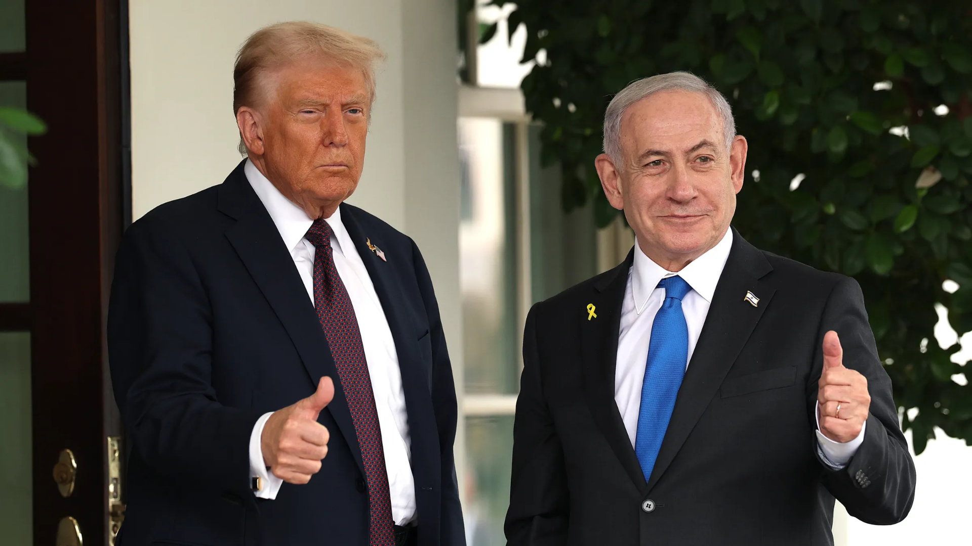 President Trump and Prime Minister Netanyahu waving at cameras