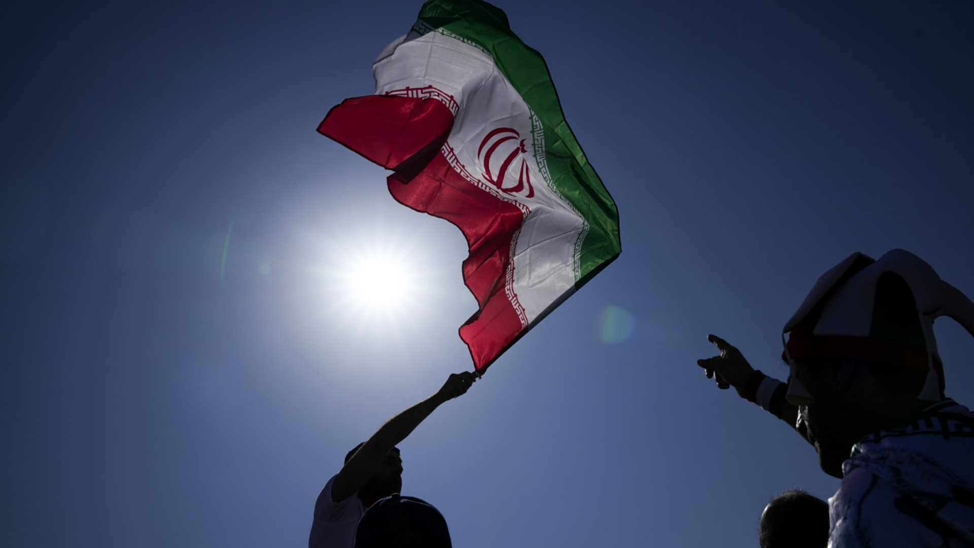 Man waving Iranian flag