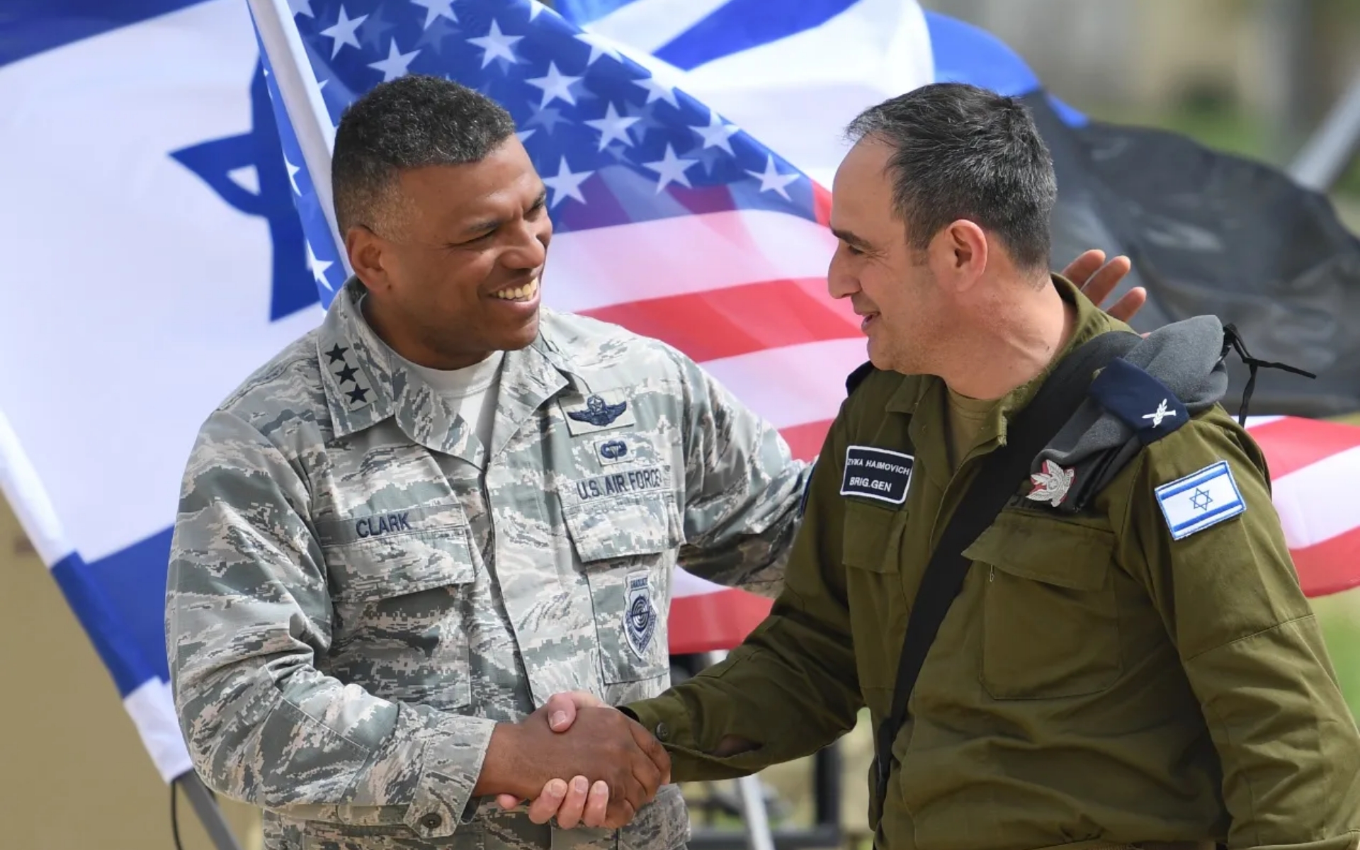 american and israeli military leaders shaking hands