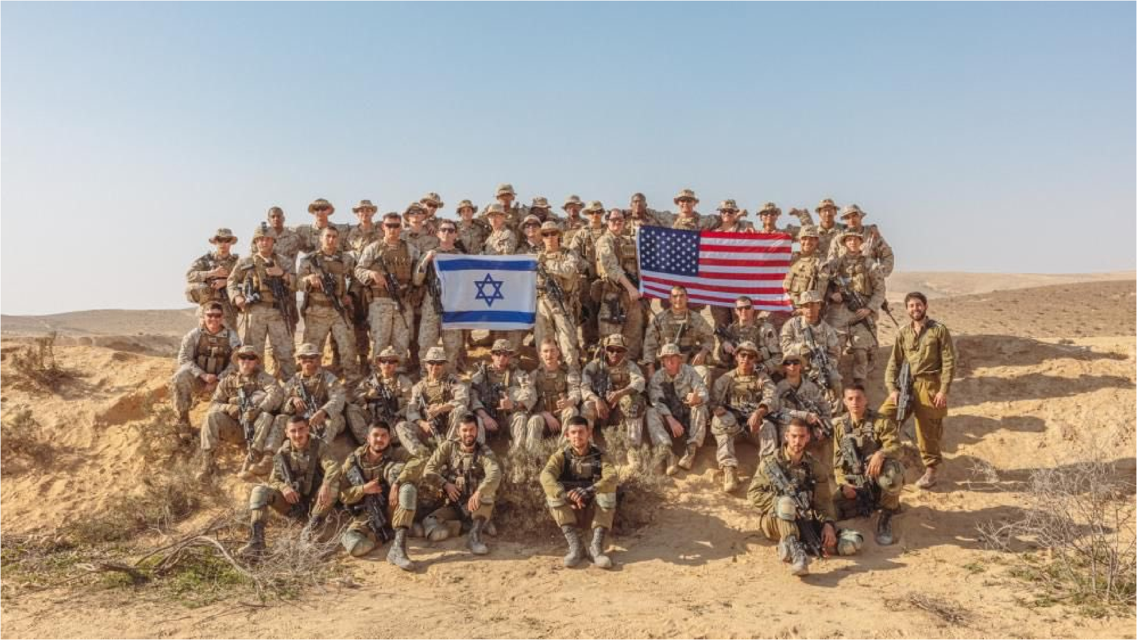 american and israeli troops together holding up both flags