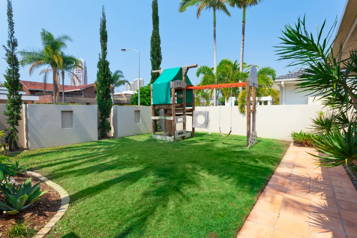 Artificial turf play area installed in a residential backyard