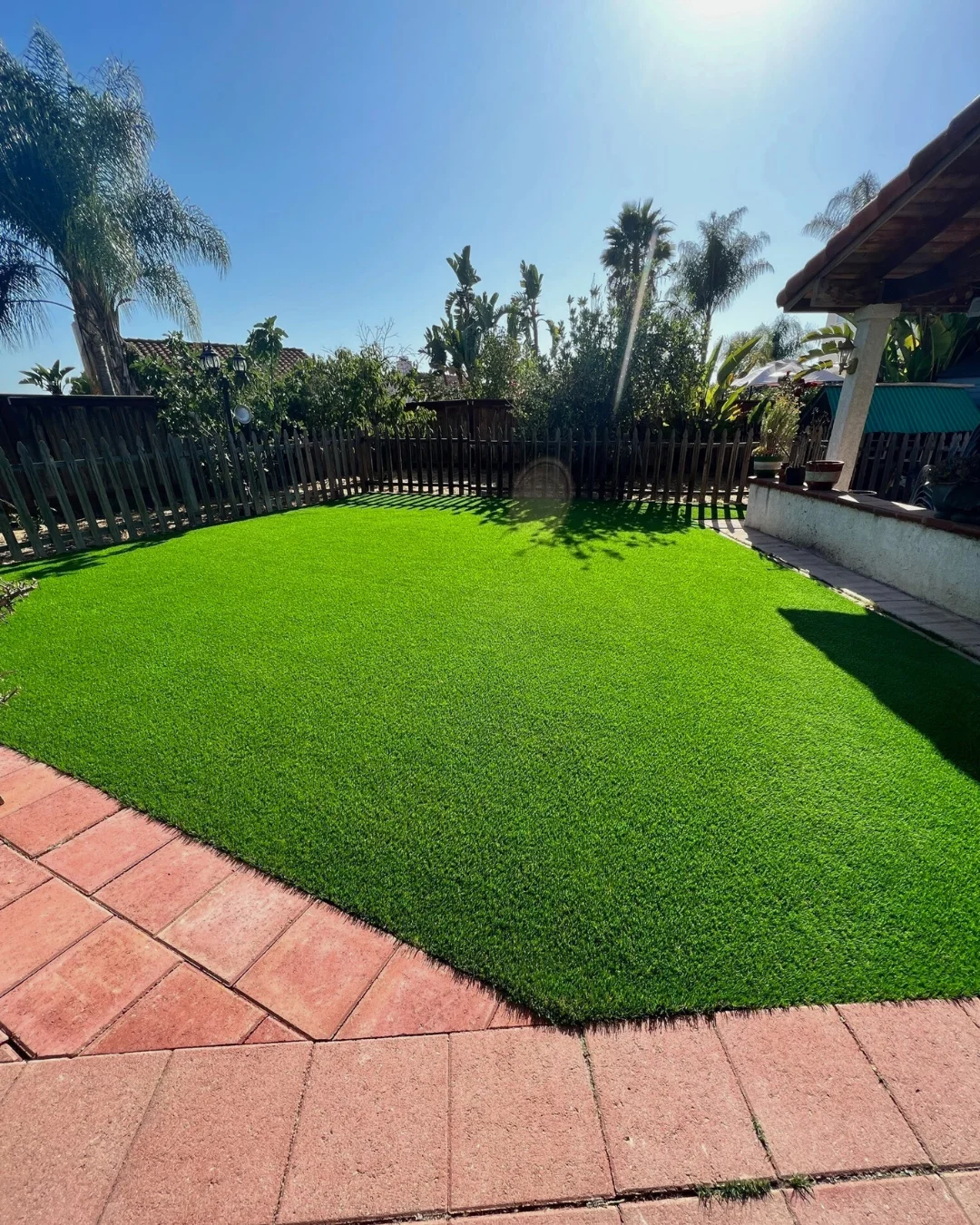 Artificial grass lawn installed in a residential backyard