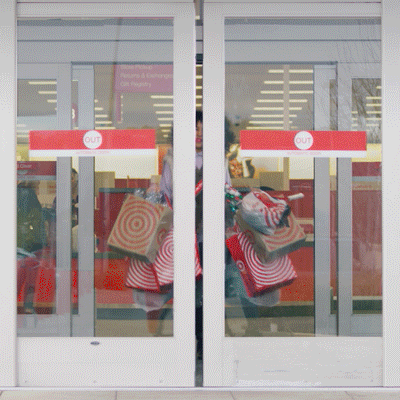 Mulher jovem saindo de loja de material escolar Black Friday Christmas GIF by Target