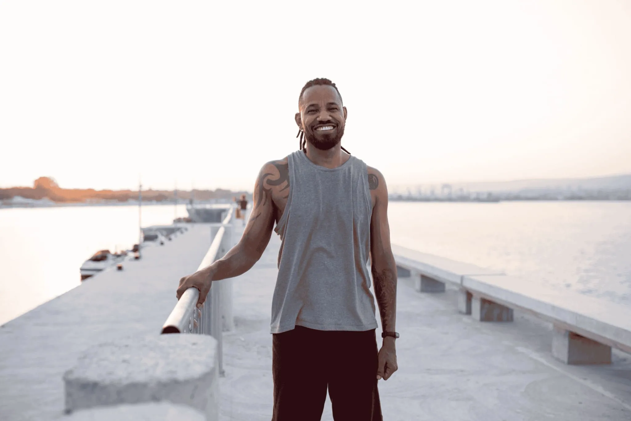 Smiling man thinking about whether testosterone can make you taller.
