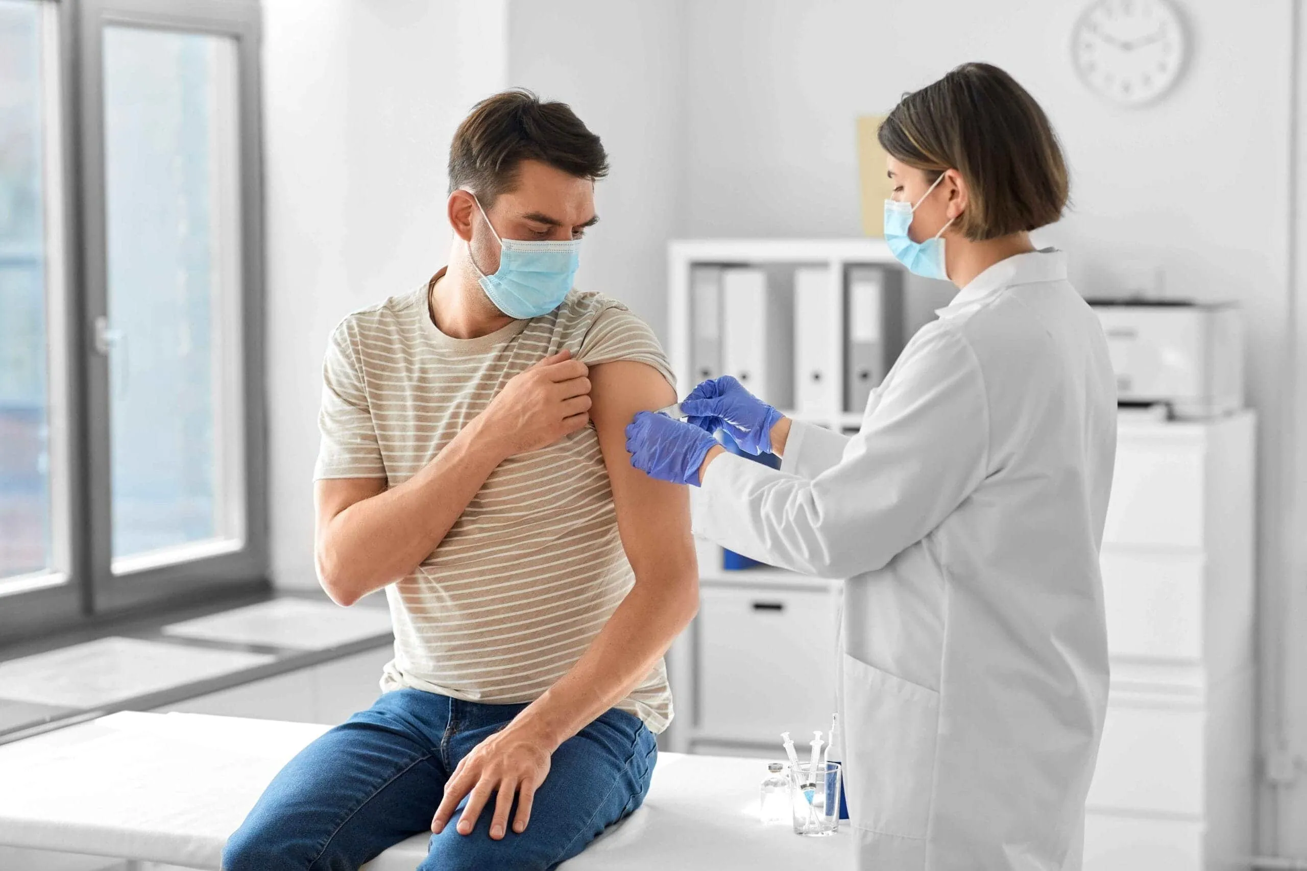 Man talking with his doctor about safe HCG dosing on testosterone therapy.