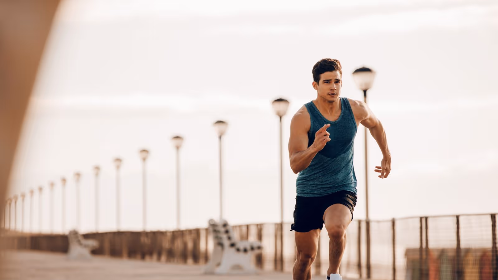 A man jogging outdoors, symbolizing the importance of physical fitness and health, which are key factors to consider when determining the ideal age to start peptide therapy for men.