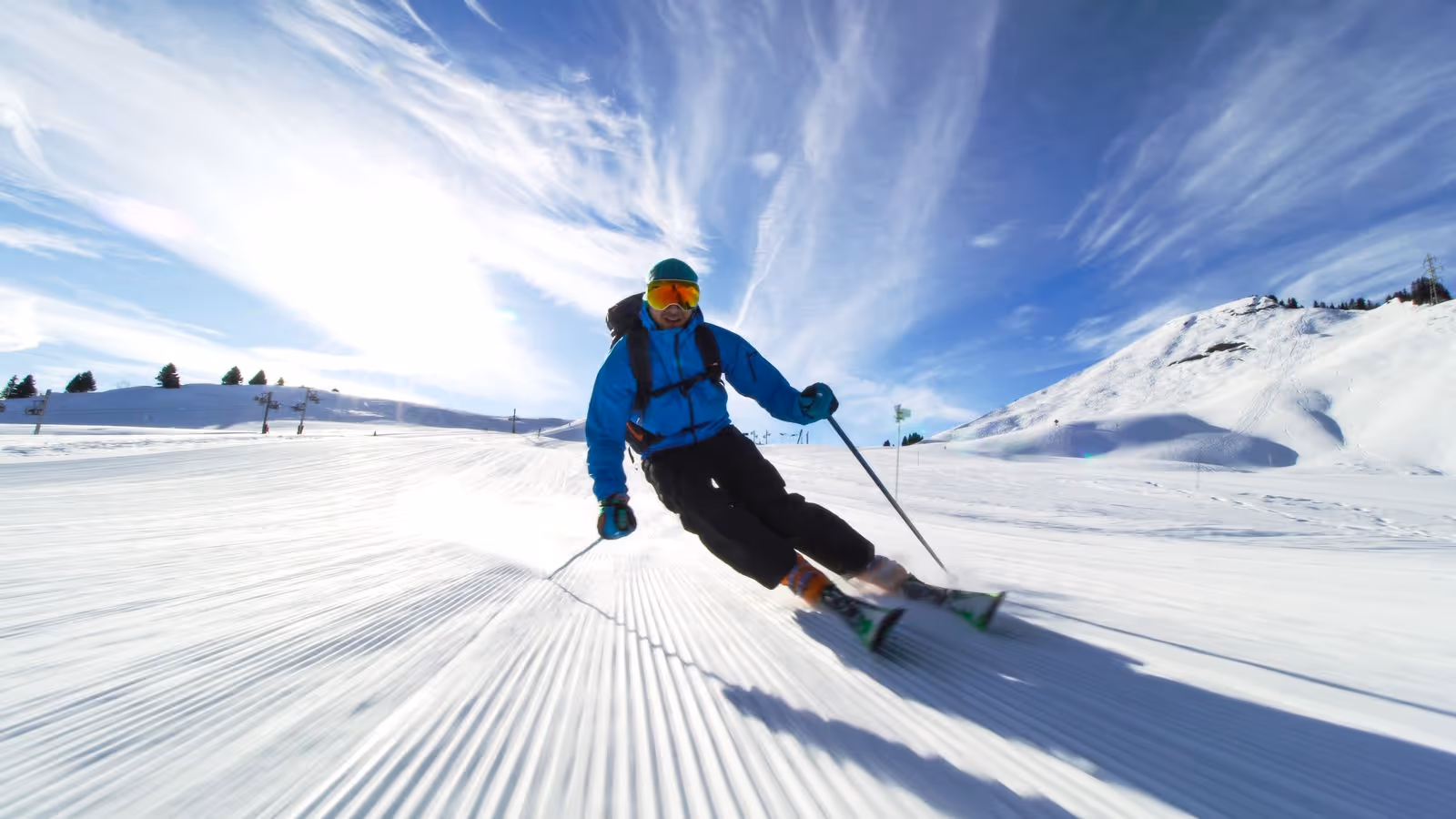 Athlete skiing at high speed on a snowy slope, representing strength and peak athletic performance supported by testosterone therapy for athletes at Gameday Men’s Health.