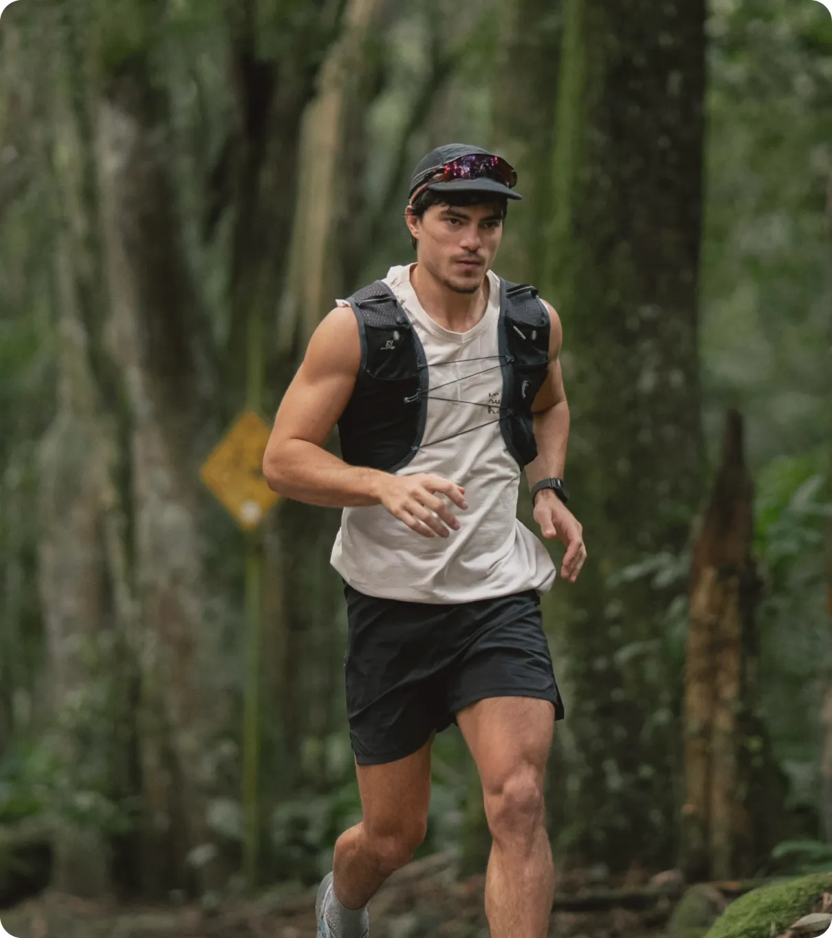 Man running through a forest trail, representing improved energy and weight-loss benefits of GLP-1 therapy.