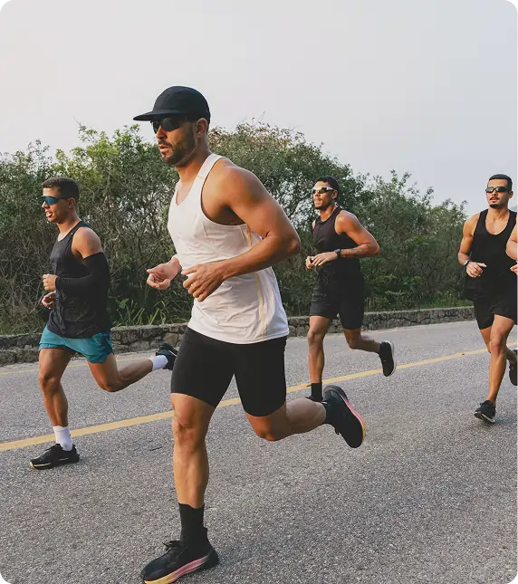 Group of men running outdoors during a fitness workout, representing improved energy and vitality from Vitamin B Complex injections at Gameday Men’s Health.
