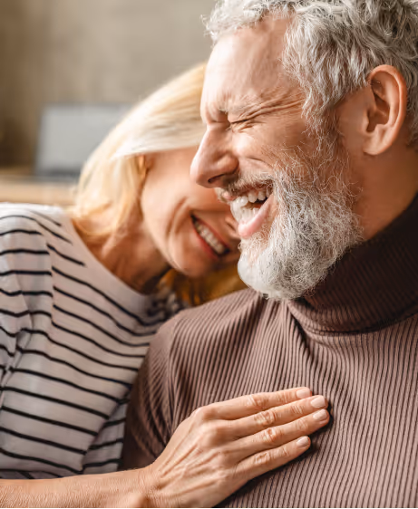 Couple enjoying a joyful moment together, illustrating the positive impact of Trimix injection on sexual wellness and performance.