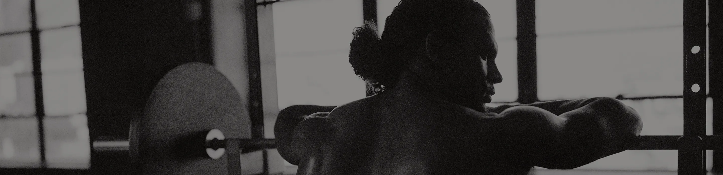 Fit man standing post-workout with a focused expression, symbolizing men seeking effective sports injury diagnosis, pain relief, and recovery solutions at Gameday Men’s Health.