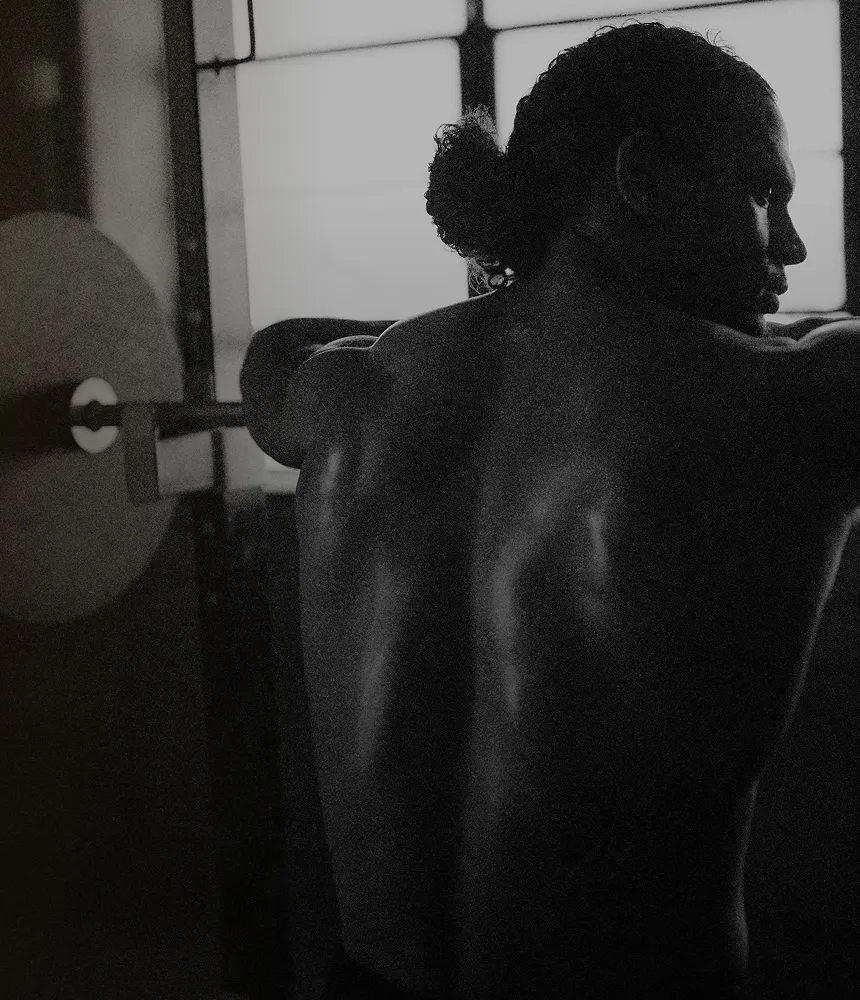 Fit man standing post-workout with a focused expression, symbolizing men seeking effective sports injury diagnosis, pain relief, and recovery solutions at Gameday Men’s Health.