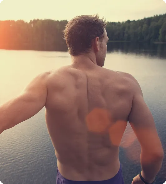 Man standing outdoors, representing strength, confidence, and vitality supported by oral TRT (Kyzatrex®)