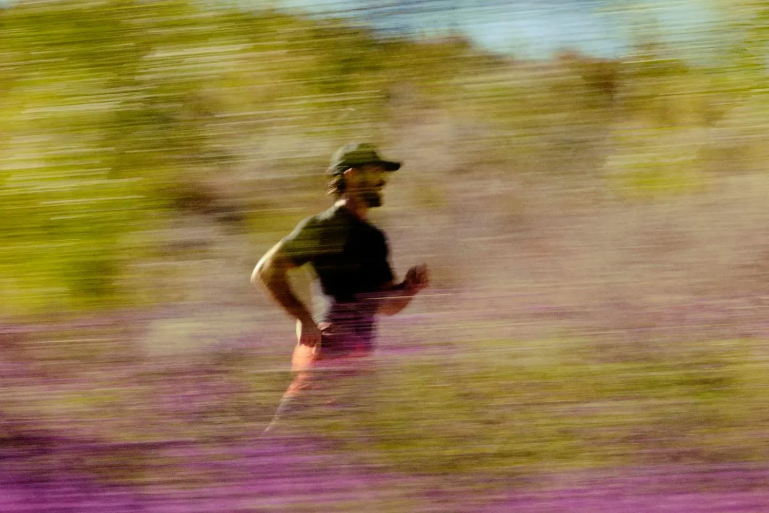Blurred photo of man running outside symbolizing the energy that NAD+ therapy provides.