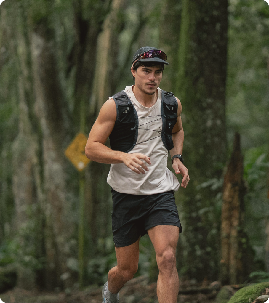 Man running through a forest trail, representing improved energy and weight-loss benefits of GLP-1 therapy.