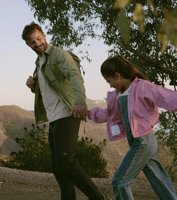Father enjoying a hike with his daughter, illustrating the lifestyle benefits and improved well-being after receiving bioidentical testosterone pellet treatment.