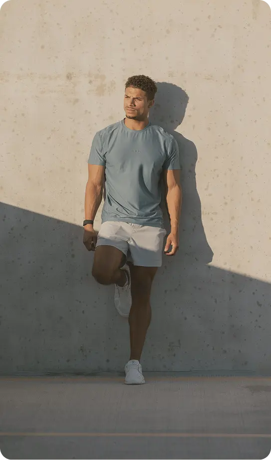 Confident man leaning against a wall, reflecting modern men’s wellness care at Gameday Men’s Health in Markham, ON