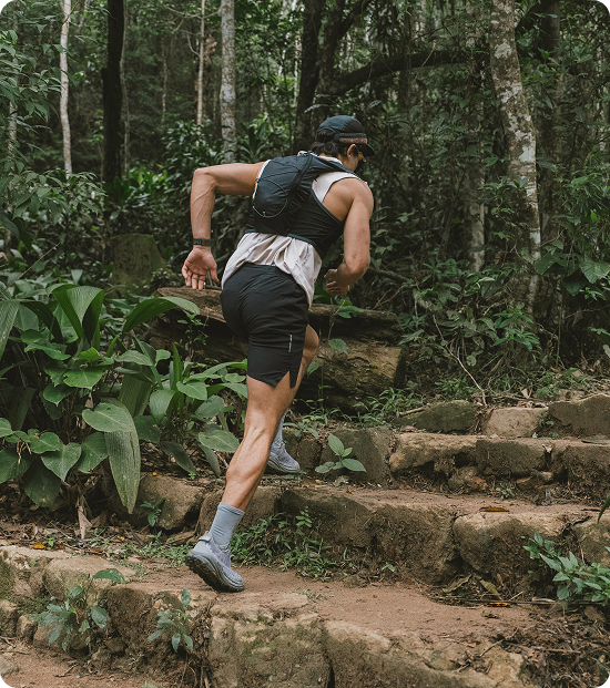 Man exercising uphill in nature, reflecting lifestyle performance support associated with MIC B12 therapy in Friendswood, TX.