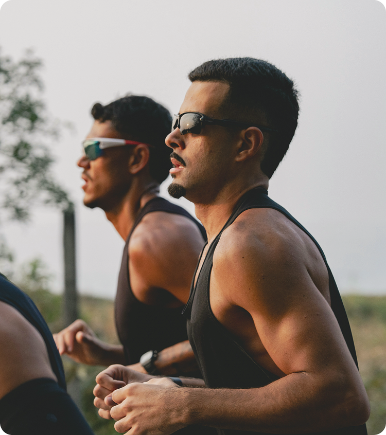 Two men running outdoors together, representing motivation, endurance, and wellness supported by Vitamin B Complex injections in Friendswood, TX.