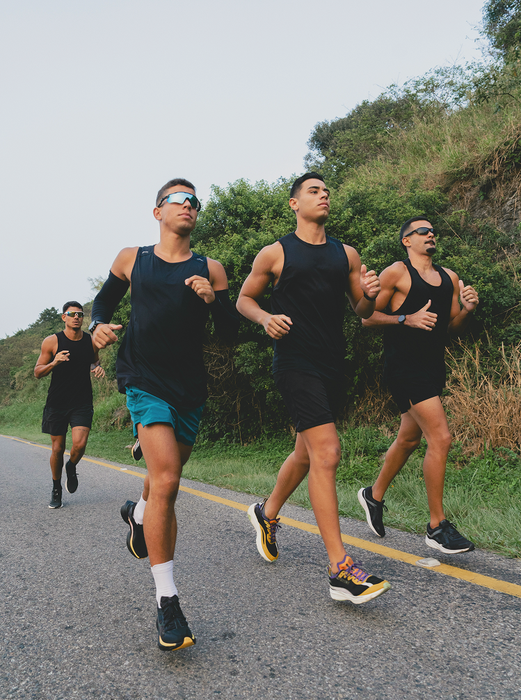 Group of men running together on a road, symbolizing endurance, performance, and active lifestyles supported by NAD+ Injections in West Edmonton, AB.
