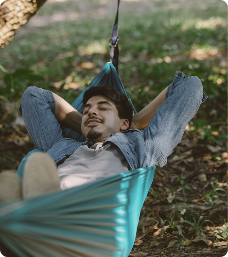 Man resting outdoors surrounded by nature, symbolizing wellness and sustainable progress connected to AOD-9604 Peptide Injections in {{location_name}}