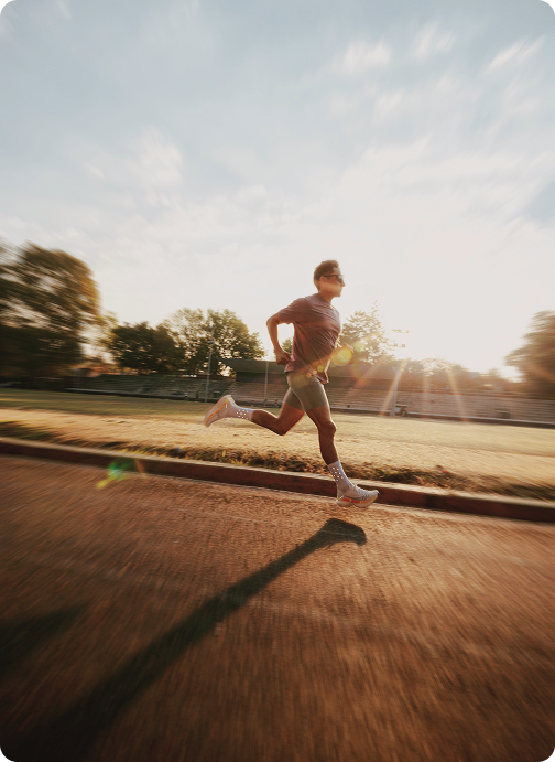 Man running outdoors at sunrise, reflecting recovery, mobility, and active lifestyle supported by BPC-157 Injections in {{location_name}} at Gameday Men’s Health {{location_name}}