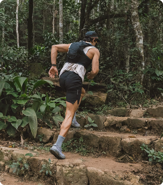 Man exercising uphill in nature, reflecting lifestyle performance support associated with MIC B12 therapy in Elmhurst, Illinois.