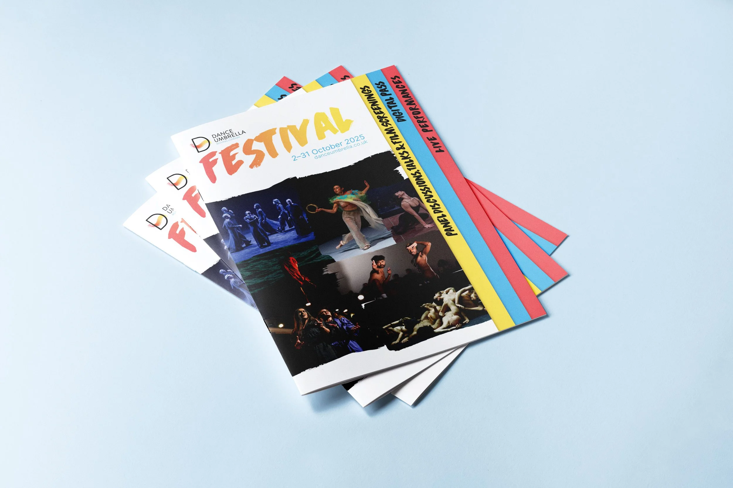 A pile of Dance Umbrella programmes