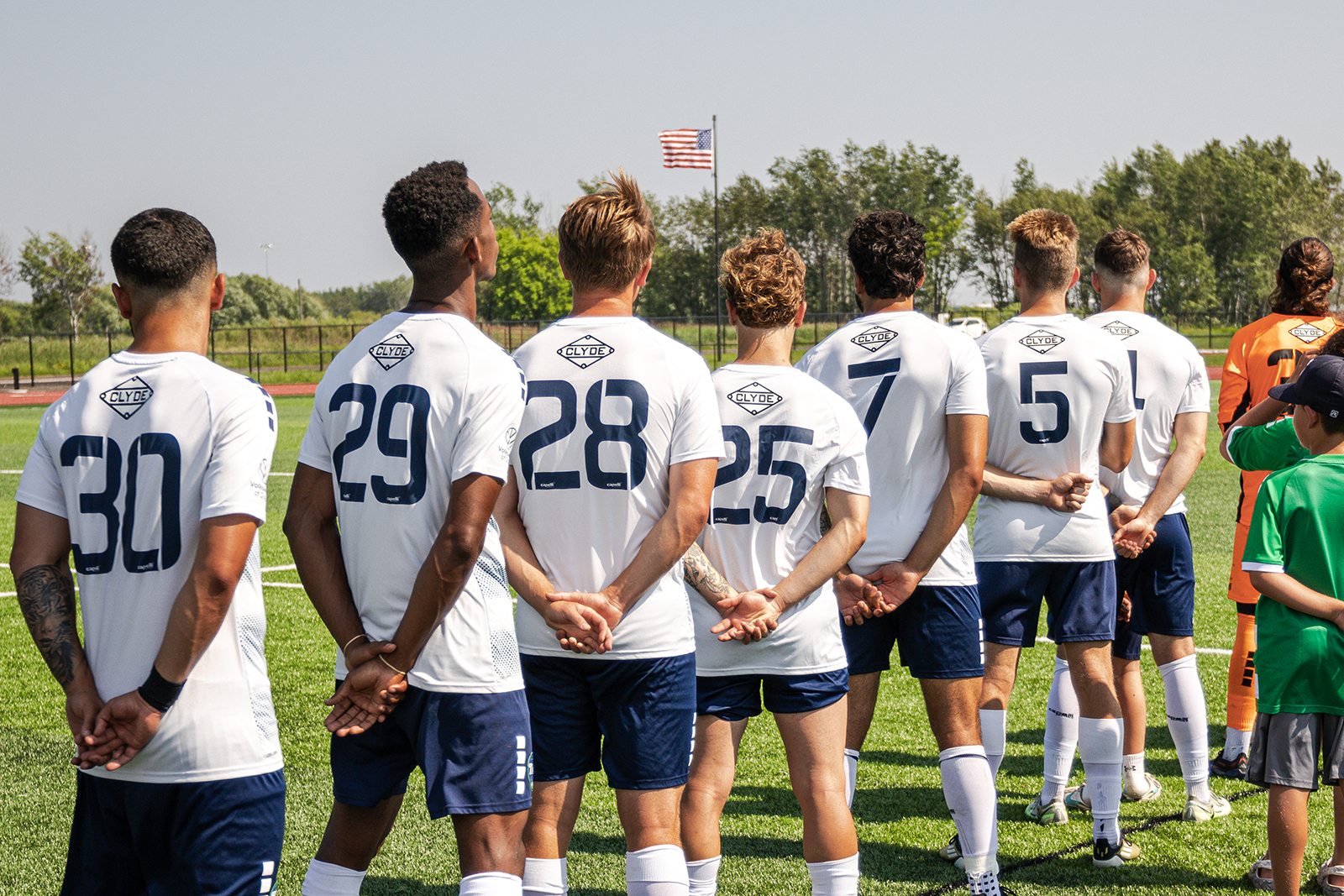 Duluth FC athletes during National anthem