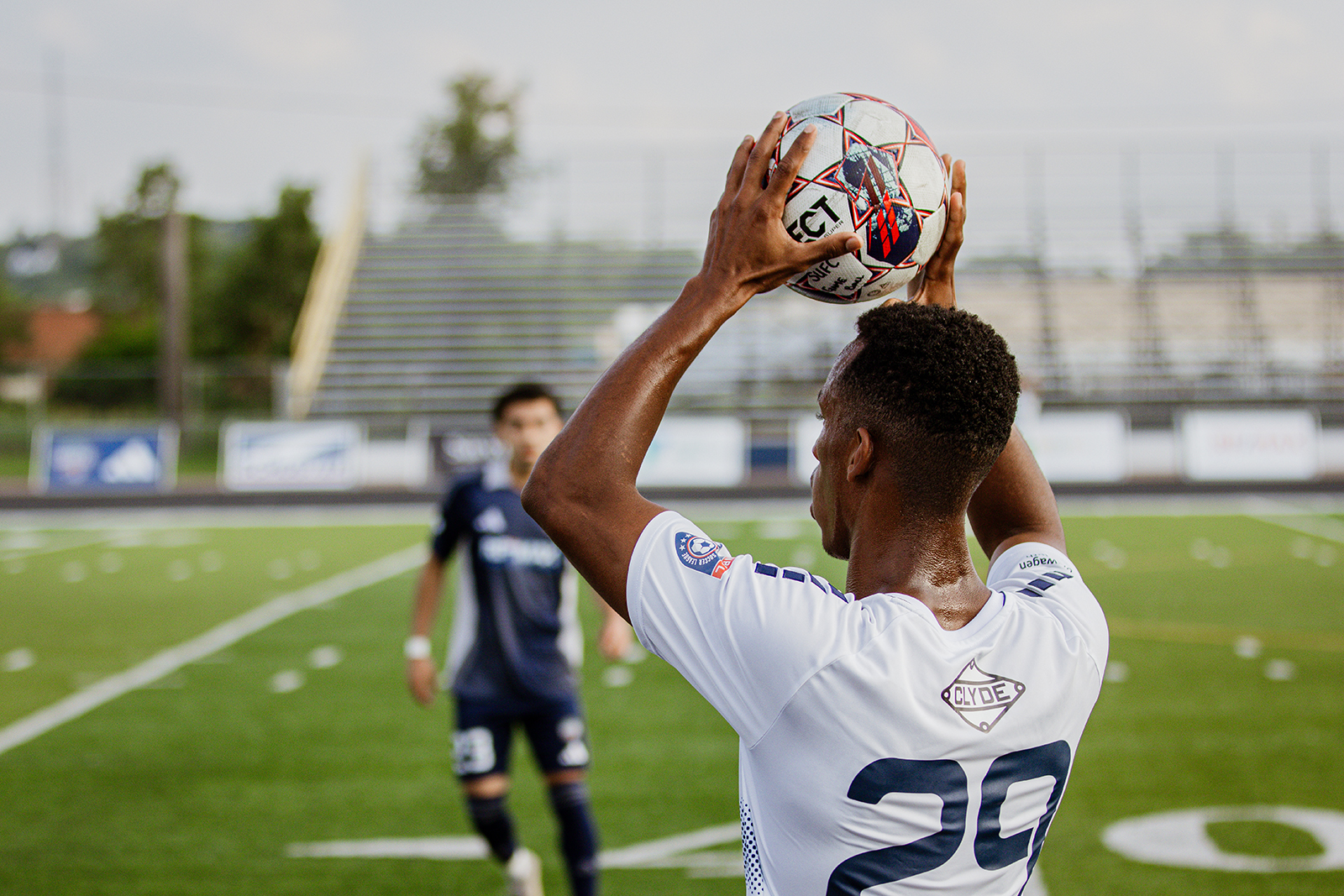 Duluth FC player throws ball from sideline