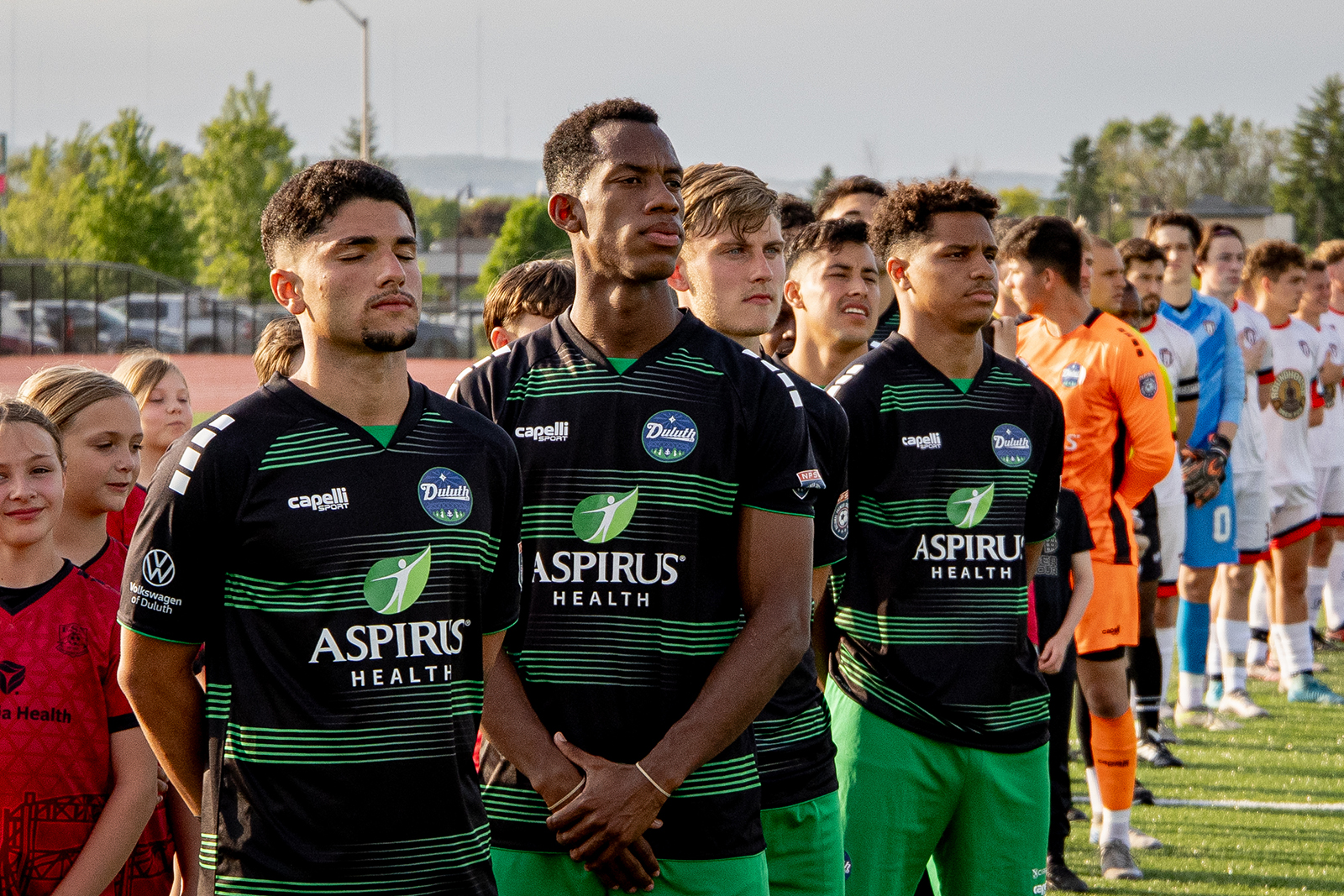 Duluth FC solemn players at the sideline