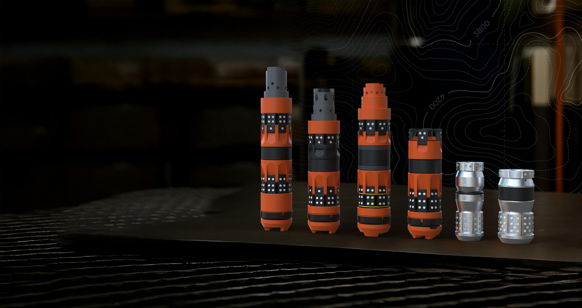 Longbow Completion Services fracking plugs on an industrial work bench.