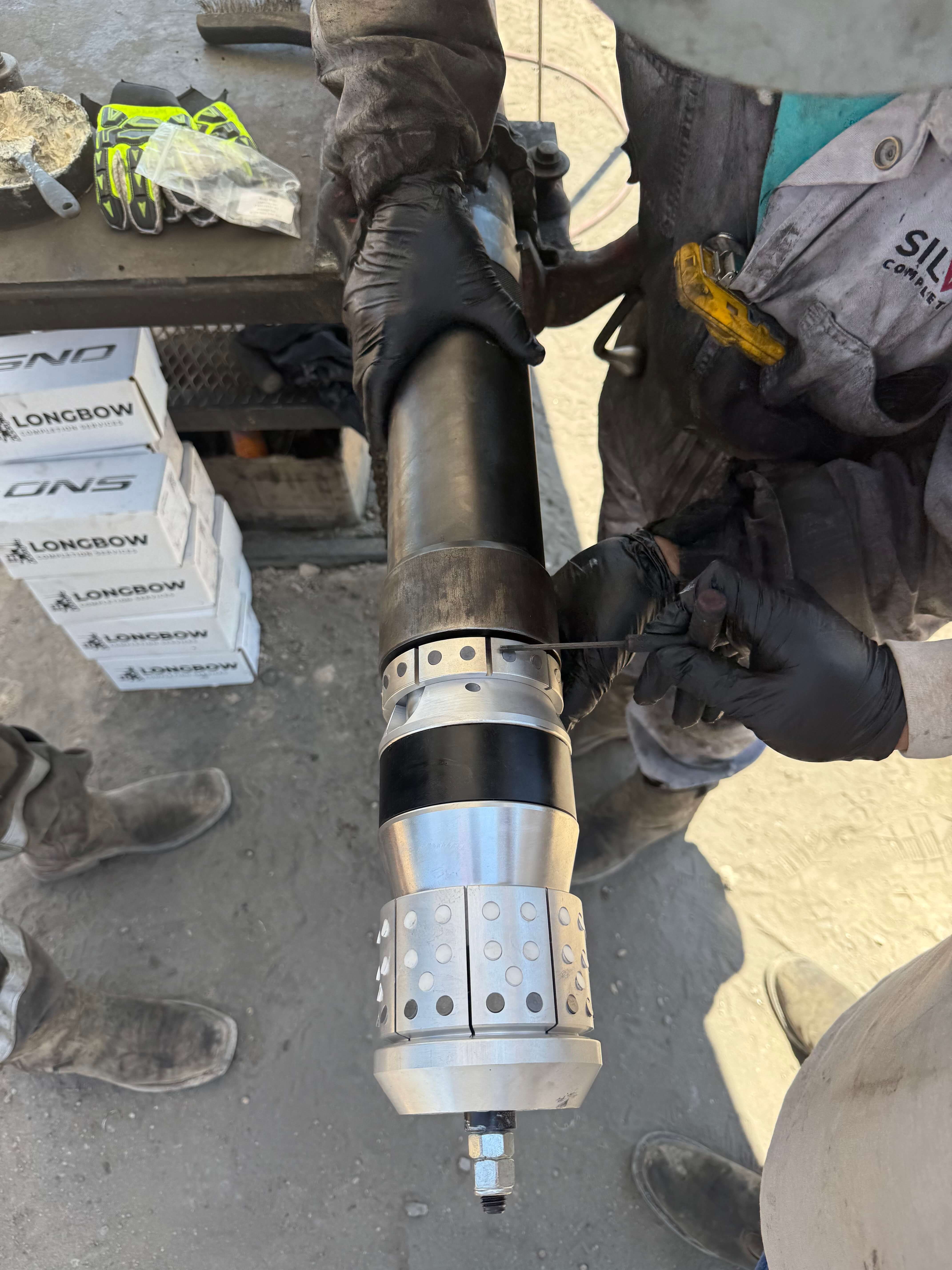 Man working on ONS Dissolvable Frac Plug