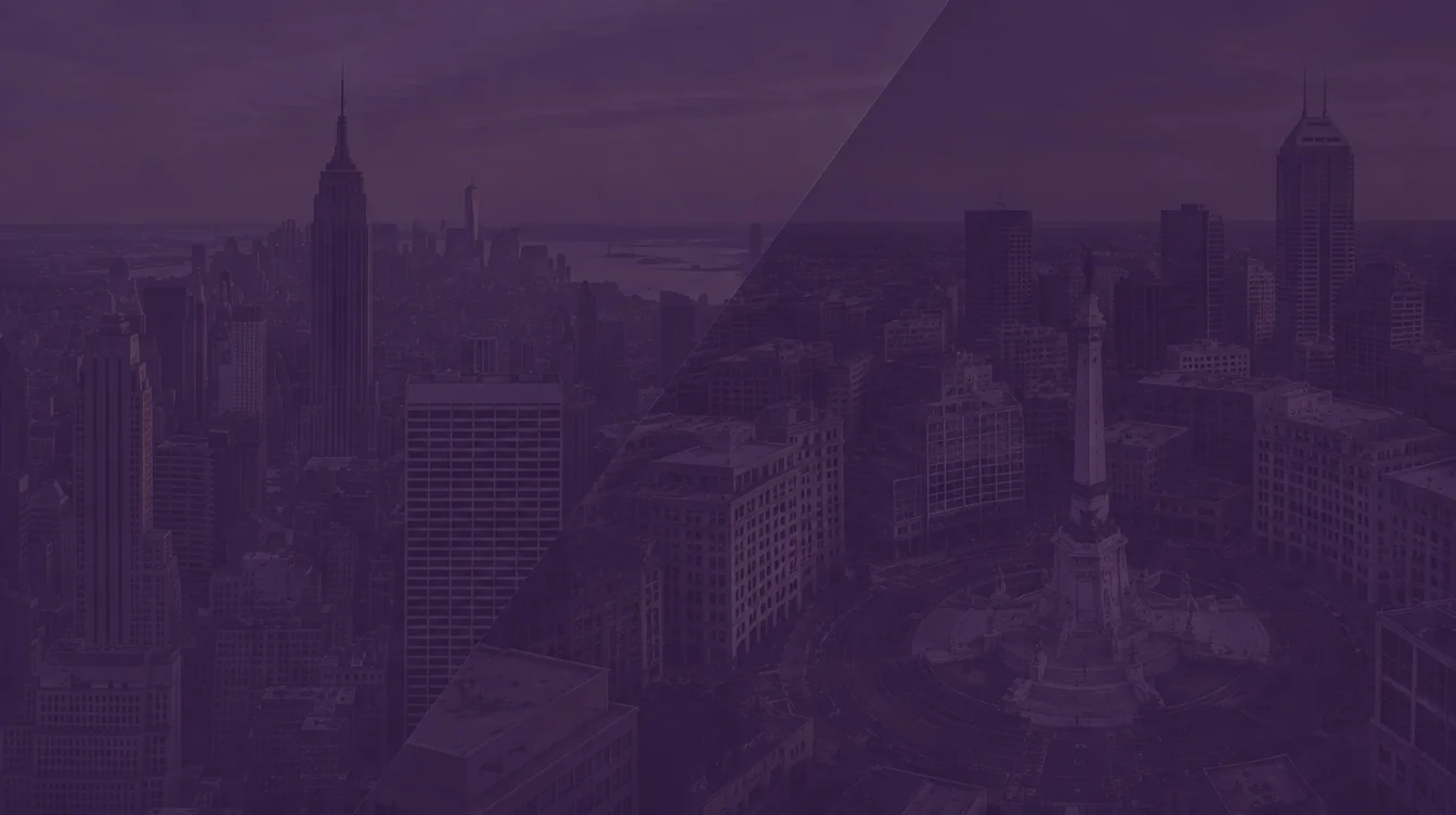 Aerial view of the Manhattan skyline with the Empire State Building beside downtown Indianapolis and the Soldiers' and Sailors' Monument, under a dark purple overlay