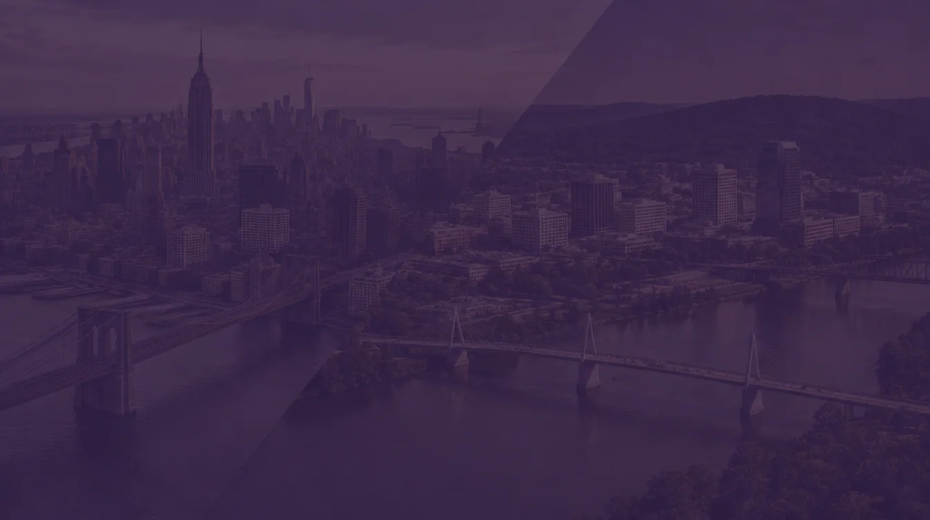 Aerial view of the Manhattan skyline with the Empire State Building and Brooklyn Bridge beside the Little Rock skyline on the Arkansas River, under a dark purple overlay