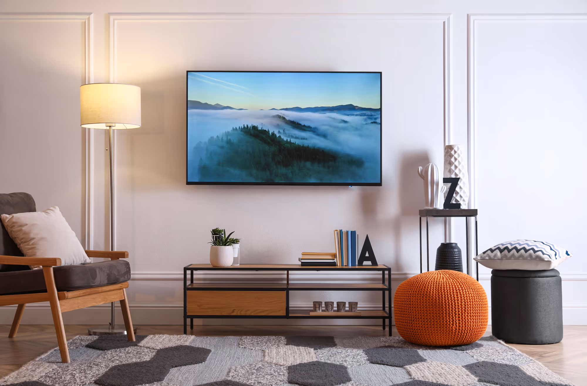 A television mounted on living room wall.