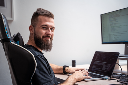 Martin Capek working at his laptop.