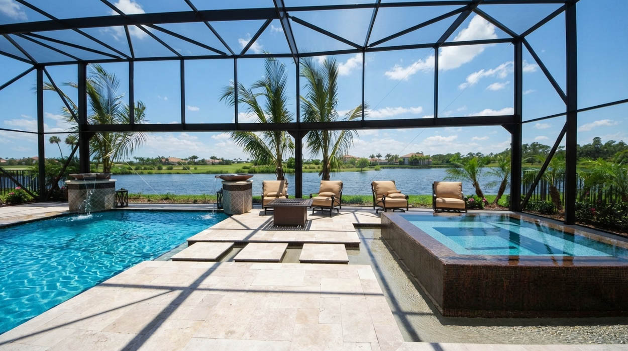 Luxury pool and spa screen enclosure with premium finishes built by Florida pool enclosure construction experts.