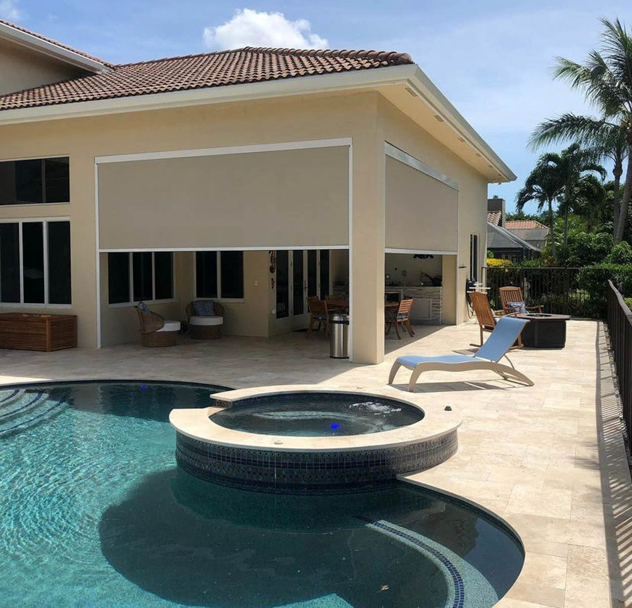 High-end pergola system with motorized retractable screens designed for luxury outdoor living in modern Florida homes.