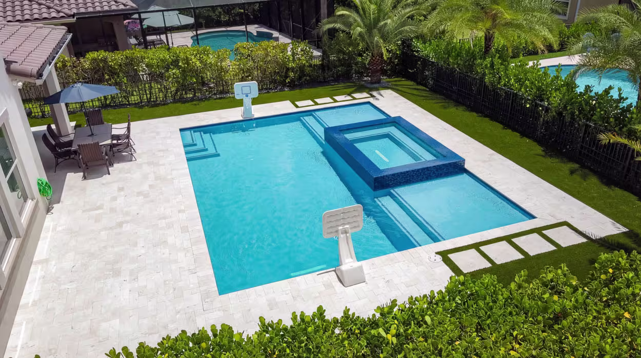 Modern custom pool in North Florida with clean geometric design, high-end finishes, and professionally designed outdoor living area.