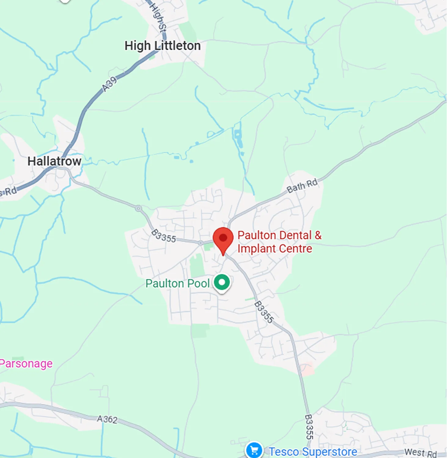 Map showing locations of Paulton Dental & Implant Centre, Paulton Pool, and Tesco Superstore near Hallatrow and High Littleton in the UK.
