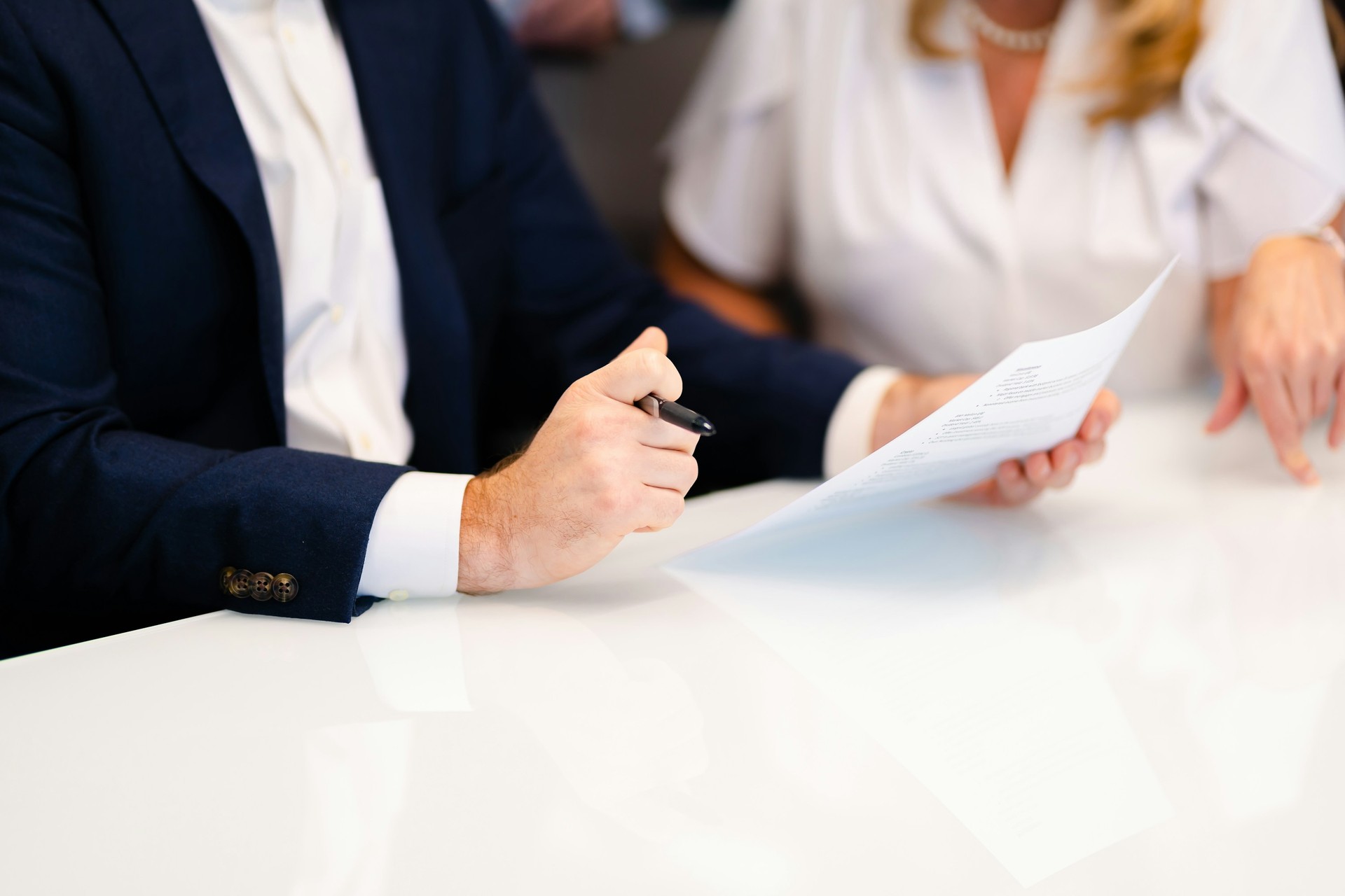 HR adviser handing a social insurance document to an employee