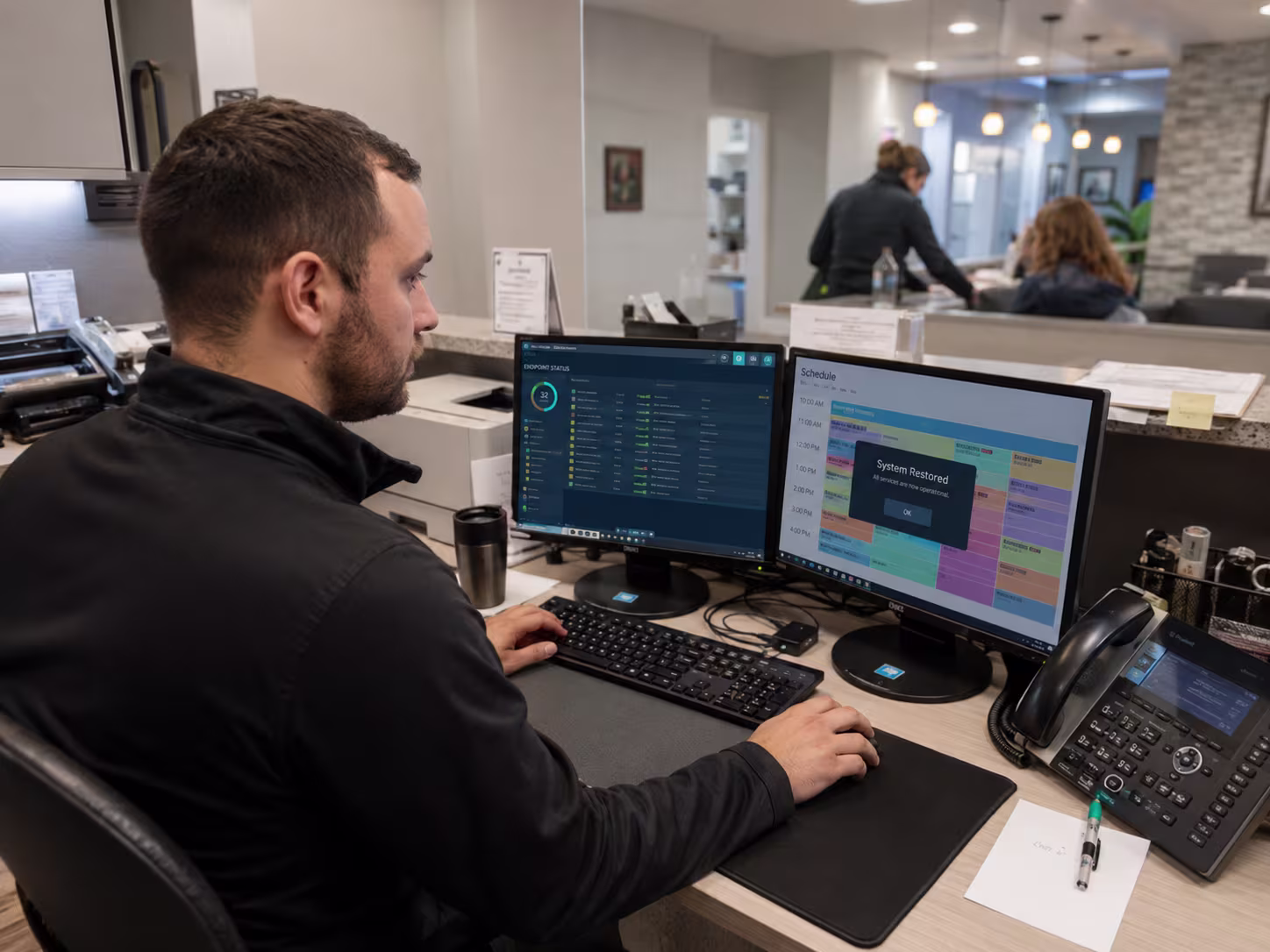 Hispanic IT technician analyzing network